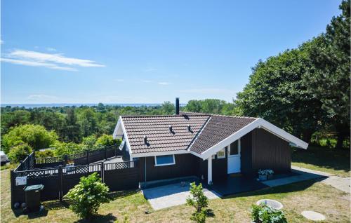 a small house with a roof on top of it at Stunning Home In Sjællands Odde in Yderby