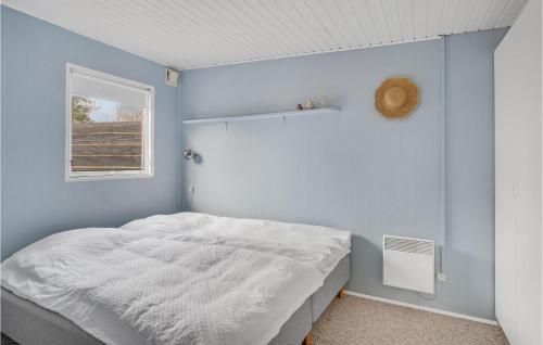 a bedroom with a white bed and a window at Stunning Home In Nykøbing Sj With Wifi in Nykøbing Sjælland