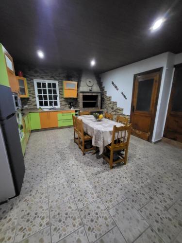 a kitchen with a table and chairs in a room at Casa Sara 2 in Icod de los Vinos