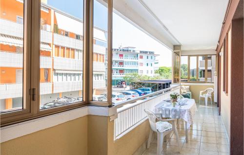 a balcony with a table and a view of a city at App Rosa in Lido