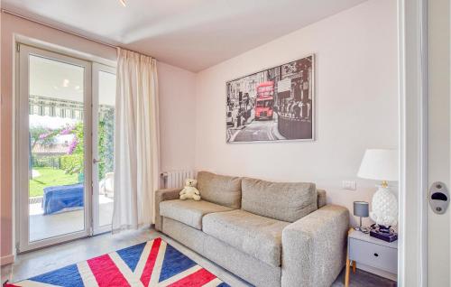 a living room with a couch and a window at 3 Bedroom Stunning Home In Lazise in Lazise