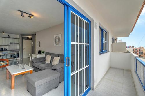 a living room with a couch and a table at Apartamento Retama in Adeje