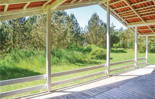 a porch with a view of a field at Three-Bedroom Holiday Home In Norre Nebel in Nørre Nebel