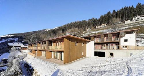 a building on top of a snow covered mountain at Schöneben Haus Wenters in Wald im Pinzgau