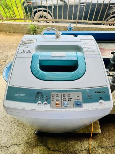 a toaster oven sitting on the ground at Kamizawa Villa - BBQ x オーシャンビュー in Kumiage