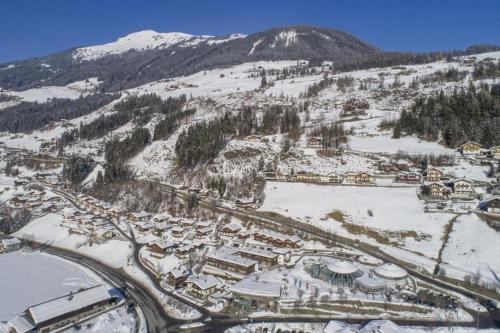 an aerial view of a resort in the snow at Schöneben Haus Sonneck in Wald im Pinzgau