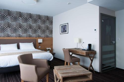 Ένα ή περισσότερα κρεβάτια σε δωμάτιο στο Le Lodge Brit Hotel Strasbourg Zenith