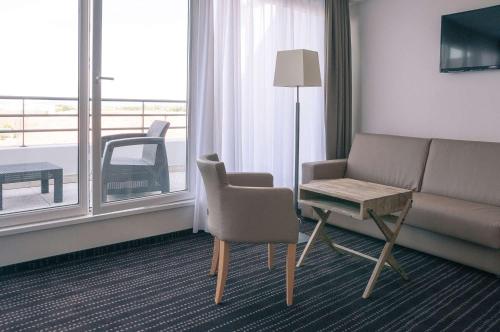Χώρος καθιστικού στο Le Lodge Brit Hotel Strasbourg Zenith