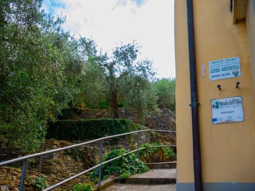 a set of stairs with signs on the side of a building at Agri Borgata Vallone - Apartments - by HOST4U in Lecchiore