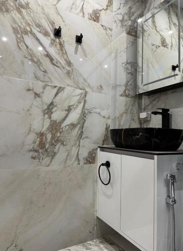 a white bathroom with a sink and a mirror at Galaxy Luxury in Torrevieja
