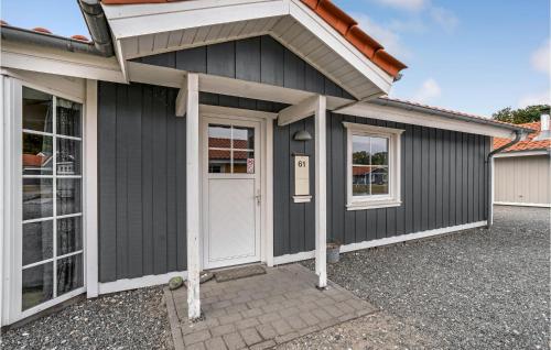 a black garage with a white door and windows at Stunning Home In Gråsten With Wifi in Gråsten