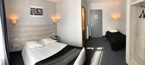 a hotel room with a bed and a small bedroom at Campanile Grenoble Centre Gare in Grenoble
