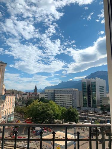 a view of a city with a cloudy sky at Campanile Grenoble Centre Gare in Grenoble