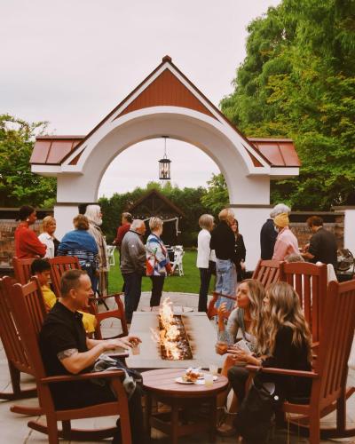 a group of people sitting around a table with cake at Normandy Farm Hotel & Conference Center in Blue Bell