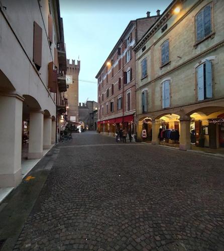 an empty street in a city with buildings at B&B La Fontana in Spilamberto