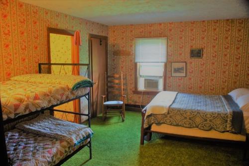 Ένα ή περισσότερα κρεβάτια σε δωμάτιο στο Wilderness Lodge - perfect family reunion