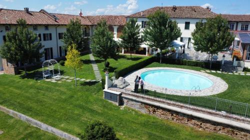 an overhead view of a yard with a swimming pool at Agriturismo Podere La Piazza in Costigliole dʼAsti