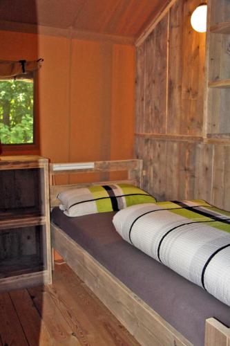 a bedroom with two beds in a room at Safarizelte in Lychen