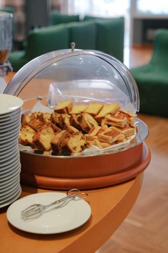 a display of food in a container on a table at Hotel Scogliera in Numana