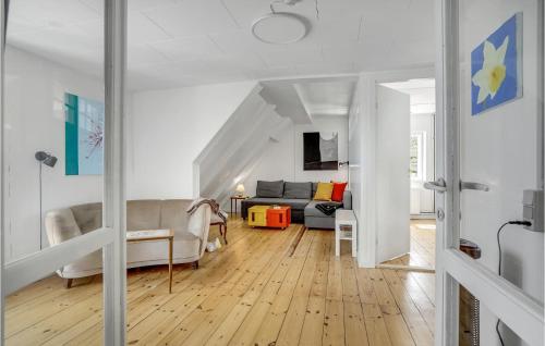 a living room with a couch and a table at Awesome Home In Martofte With Wifi in Martofte
