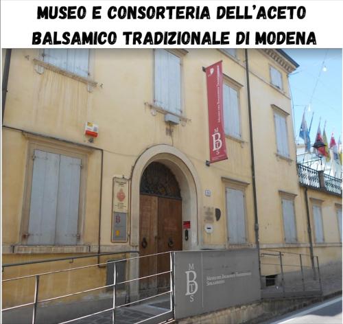 a building with a sign on the front of it at B&B La Fontana in Spilamberto