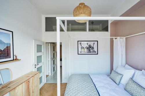 a bedroom with a bunk bed in a room at Luxury riverside apartment in Prague