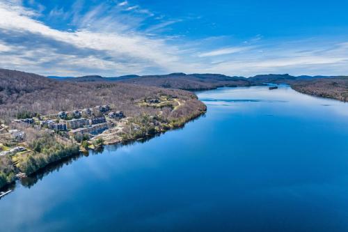an aerial view of a river with houses and trees at Lago by Tremblant Platinum in Mont-Tremblant