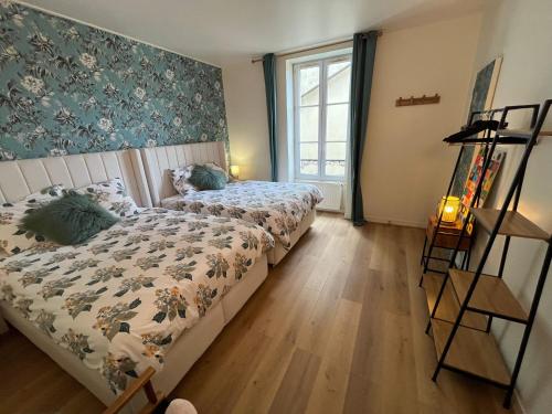 Кровать или кровати в номере Appartement RDC avec jardin au cœur de Barbizon 2 a 6 personnes