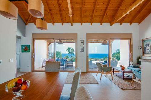 a living room with a view of the ocean at Villas Maher One in Vasilítsion