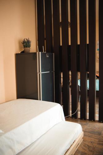 Ένα ή περισσότερα κρεβάτια σε δωμάτιο στο Halluni Apartment