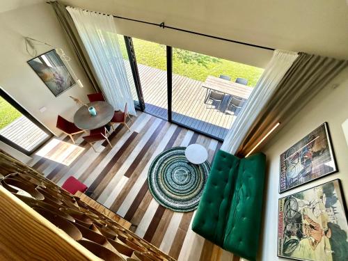 an overhead view of a living room with a table and chairs at Laimingi namai in Palanga
