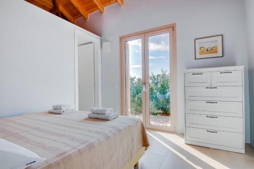 Postel nebo postele na pokoji v ubytování Villas Maher One