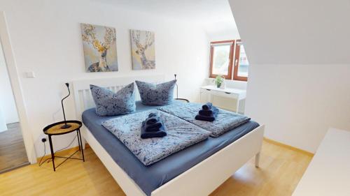 a bedroom with a bed with two stuffed animals on it at Fewo Seenah in Radolfzell am Bodensee