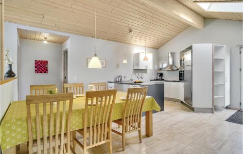 a kitchen and dining room with a table and chairs at 3 Bedroom Amazing Home In Nakskov in Nakskov