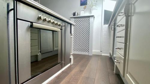 a dressing room with a mirror on the wall at Gschwendtnerhof App23 Christ in Aschau im Chiemgau