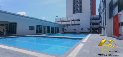 a swimming pool in the middle of a building at Anderson Suite by Hopestay Property Management in Ipoh