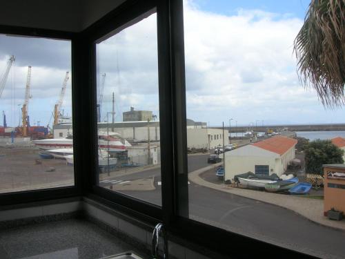 a view of a city from a window at Apartamentos Amarelo in Caniçal