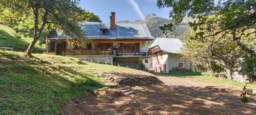 a house sitting on top of a hill at Chalet Le Loup Bouquetin in Saint-Colomban-des-Villards