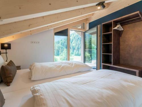 Postel nebo postele na pokoji v ubytování Penthouse Schmittenblick Top 4