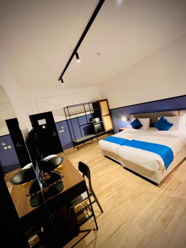 Ένα ή περισσότερα κρεβάτια σε δωμάτιο στο South32 Hotel