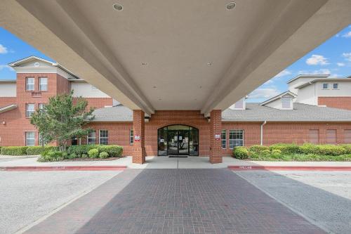 a large brick building with a large entrance at The Landmark Inn in Fort Bragg