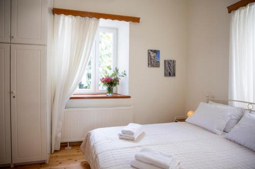 Postel nebo postele na pokoji v ubytování Eftihia's House