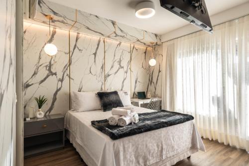 Katil atau katil-katil dalam bilik di Rosemari's Apartments 4 Studios Luxuosos
