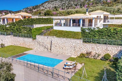 an aerial view of a house with a swimming pool at Villa Drimonas Artemis by Villa Plus in Drymon