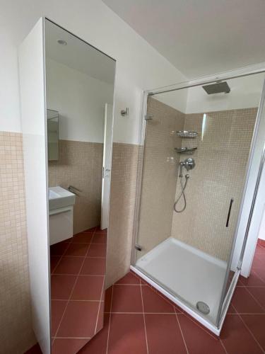 a shower with a glass door in a bathroom at Casa Panorama in Diano Marina