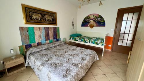 a small bedroom with a bed and a bed sidx sidx sidx sidx at King House in Nichelino