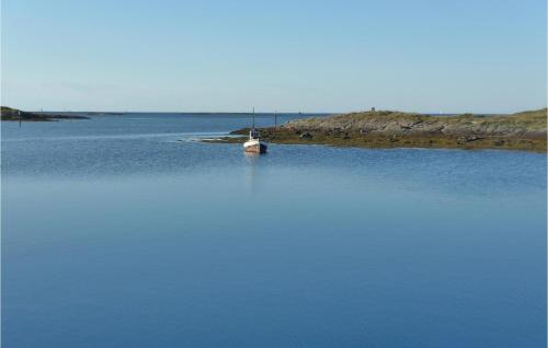a boat sitting in the middle of a large body of water at Beautiful Home In Vega With Wifi in Holand