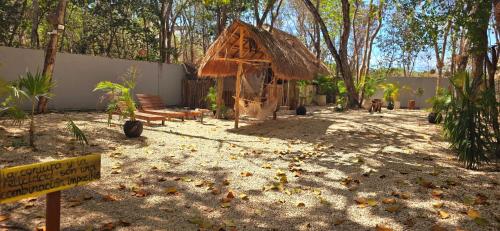 a small hut with a sign in front of it at Hotel Kin Tulum Jungle Deluxe in Tulum