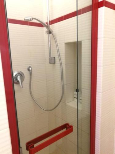 a shower with a glass door with a shower head at I POGGI SUL GOLFO in La Spezia