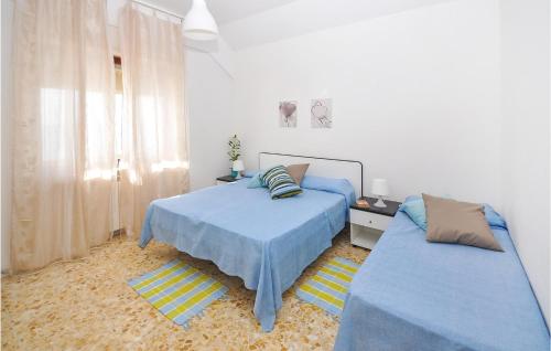 Ένα ή περισσότερα κρεβάτια σε δωμάτιο στο Gorgeous Apartment In Torvaianica